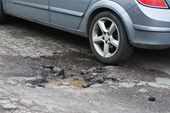 What should you do if a pothole damages your car?