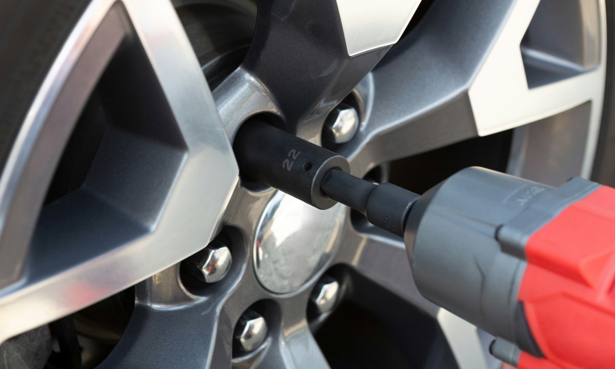 Alloy Wheel Insurance. Close up image of alloy wheel being removed for repair.